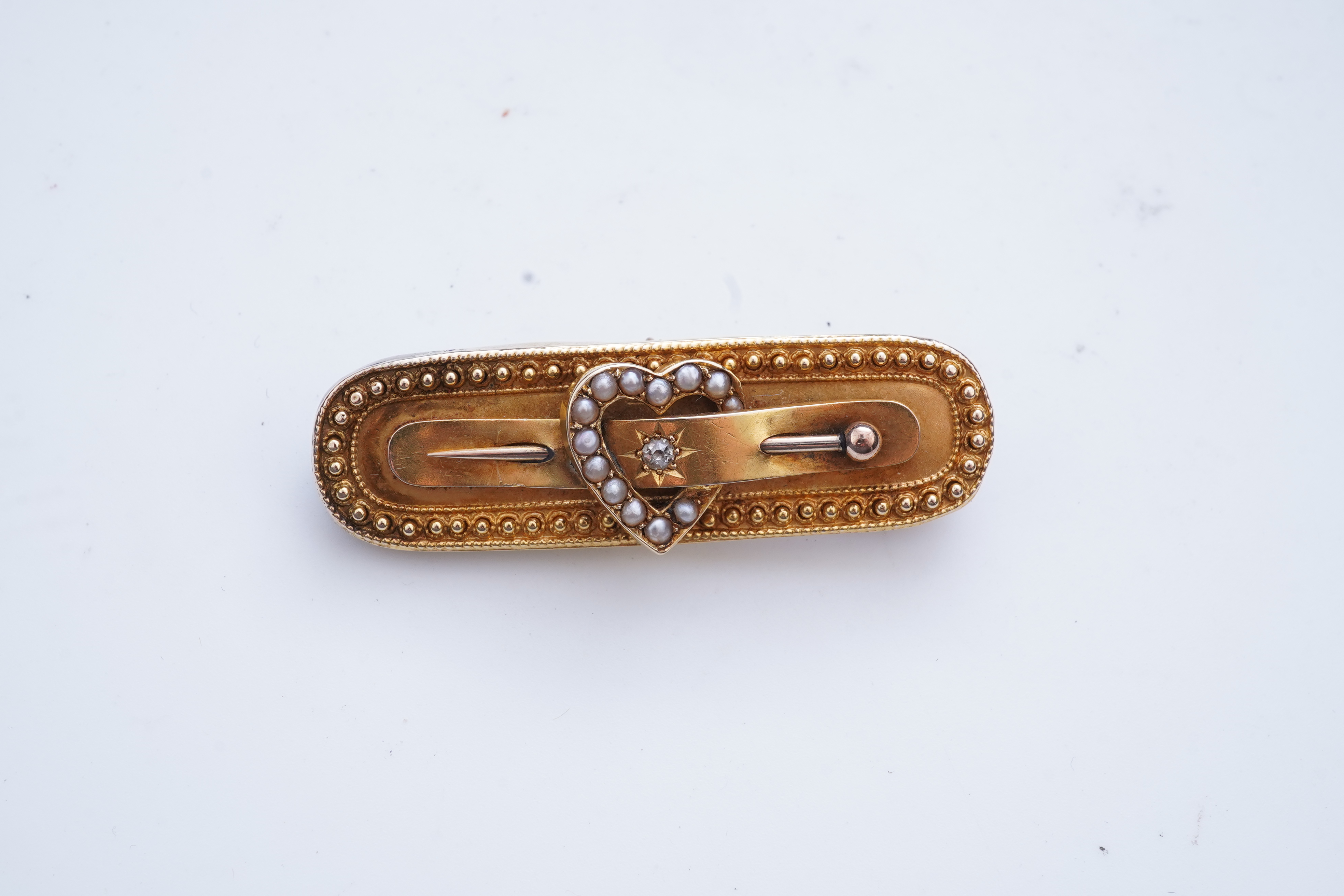An Edwardian gold and seed pearl brooch, circa 1896